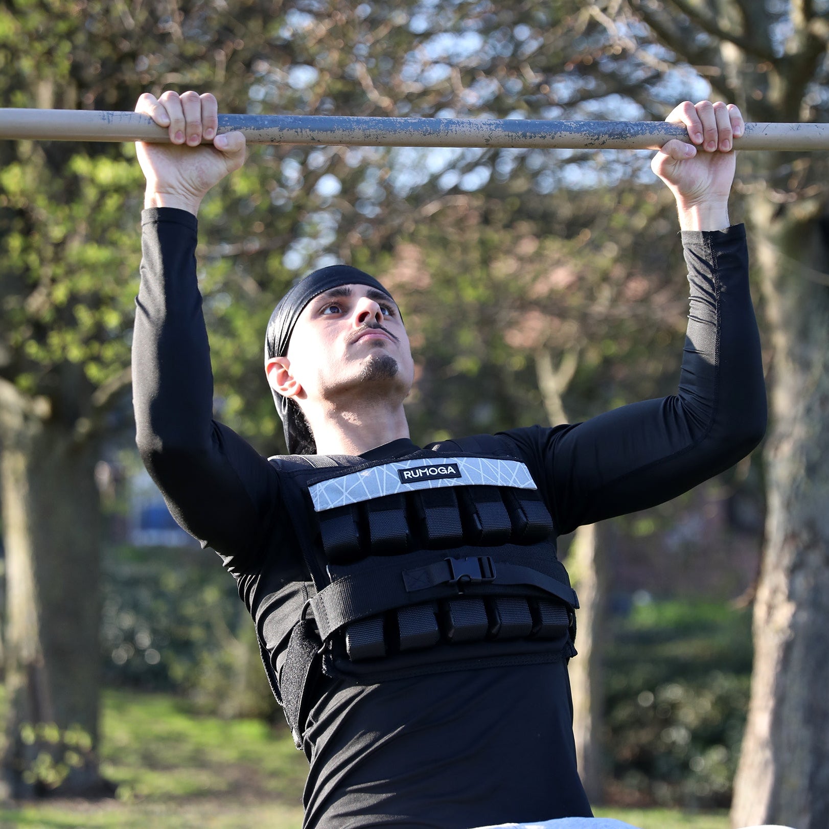 Image of an athlete wearing adjustable weighted vest completing strength exercises