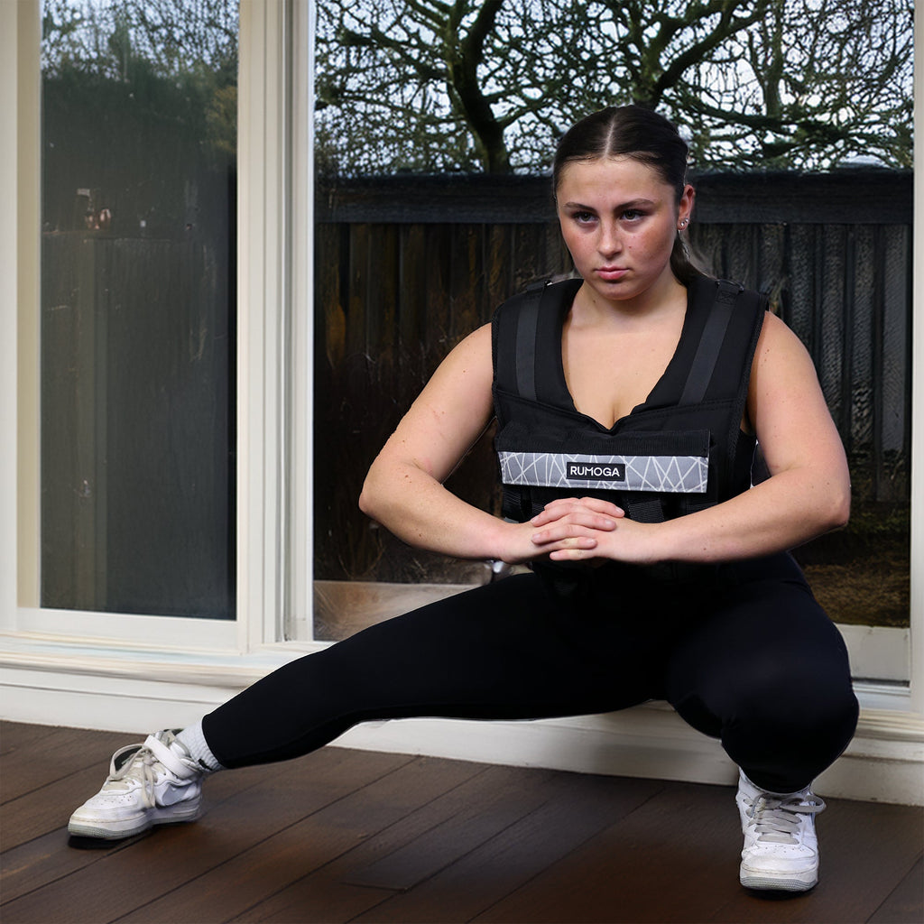 lady trying with a weight vest in the winter at home