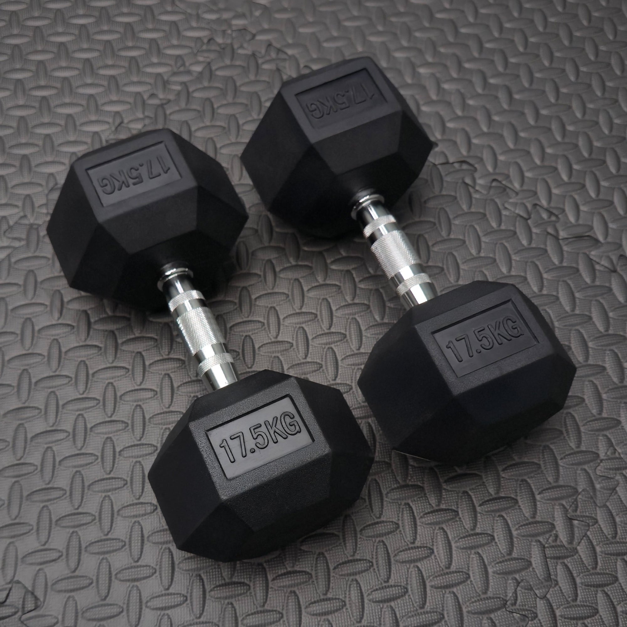 pair of 17.kg rubber dumbbells in gym