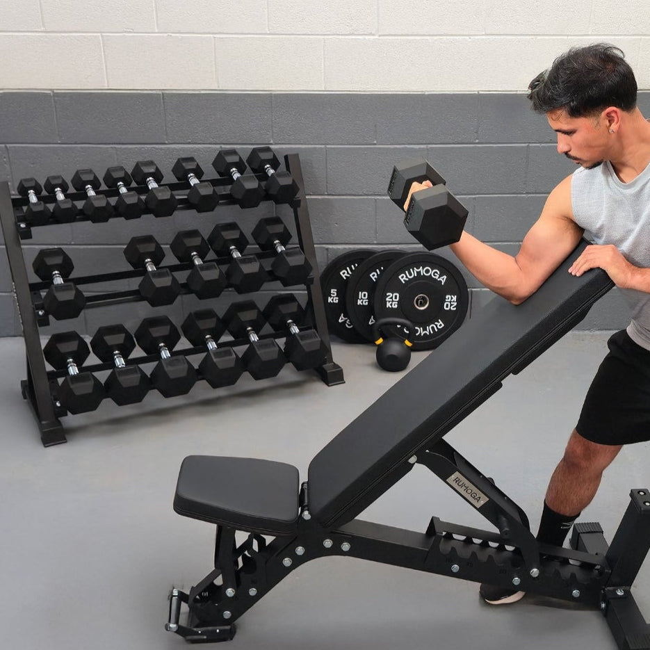 Man exercising with a hex weights in a gym setting